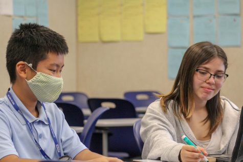 Henry Liem tutoring a fellow peer after school 