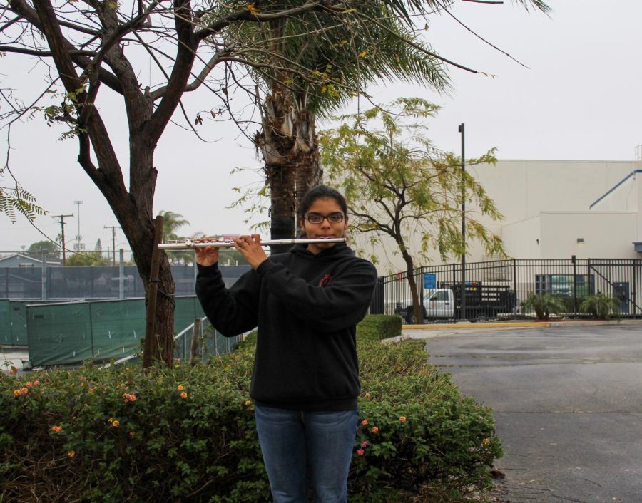 Pictured, senior Daisy Ayala playing the flute.